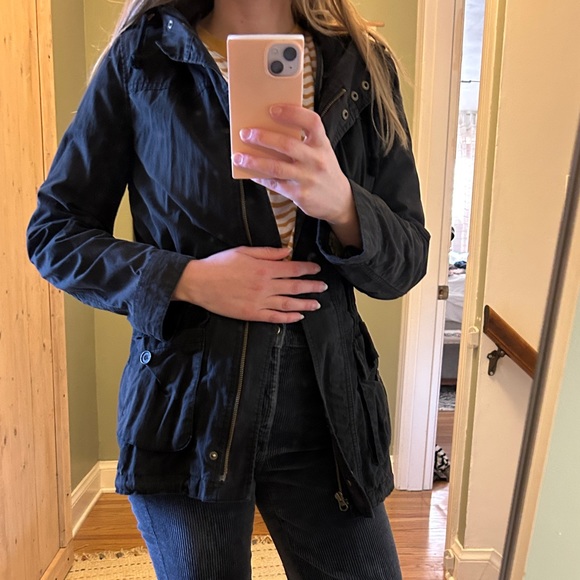 Black weather resistant mid-length jacket with quilted insert. - Picture 1 of 7